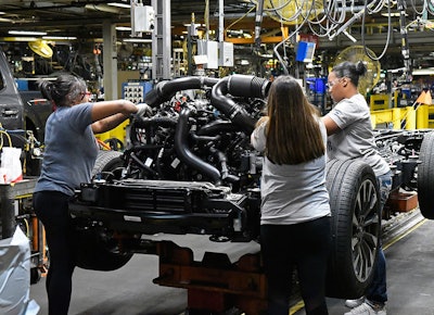 In this Friday, Oct. 27, 2017, photo, workers assemble Ford trucks at the Ford Kentucky Truck Plant, in Louisville, Ky. On Thursday, Feb. 1, 2018, the Institute for Supply Management, a trade group of purchasing managers, issues its index of manufacturing activity for January. (AP Photo/Timothy D. Easley)