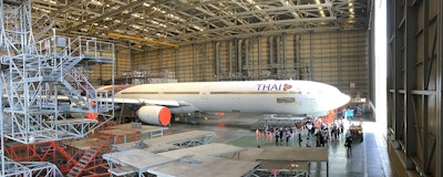 I climbed up a platform inside U-Tapao’s aircraft maintenance hangar to get this view of a Thai Airways commercial passenger plane being serviced.