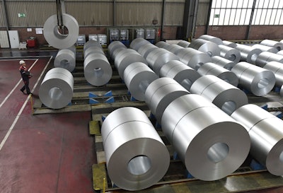 In this April 27, 2018, file photo, steel coils are stored at the Thyssenkrupp steel factory in Duisburg, Germany. Duisburg is the biggest steel producer site in Europe. Image credit: AP Photo/Martin Meissner, File