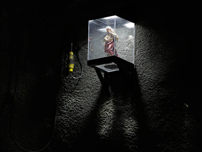 In this Wednesday, May 16, 2018 photo, a figure of Saint Barbara, patron saint of miners, sits mounted on a wall inside a 2.5-mile bypass tunnel being dug for the Delaware Aqueduct, in Marlboro, NY. (AP Photo/Julie Jacobson)