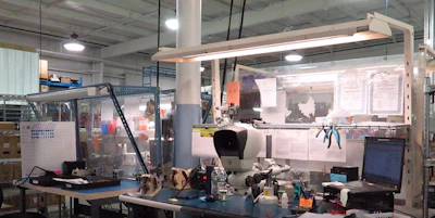 Three of the many different workbench fluorescent lighting mounting systems before the upgrade.