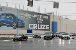 In this Nov. 27, 2018 file photo, a banner depicting the Chevrolet Cruze model vehicle is displayed at the General Motors' Lordstown plant in Lordstown, OH.