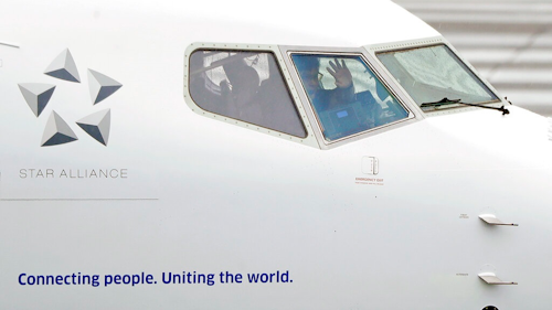A pilot waves from the flight deck of a United Airlines Boeing 737 Max airplane prior to a flight Wednesday, Dec. 11, 2019, at Renton Municipal Airport in Renton, Wash. After the first crash of a Boeing 737 Max in 2018, federal safety officials estimated that there could be 15 more fatal crashes of the Max over the next few decades if Boeing didn't fix a critical automated flight-control system, the chairman of the House Transportation Committee said Wednesday during opening remarks at the committee's fifth hearing on the Boeing 737 Max.