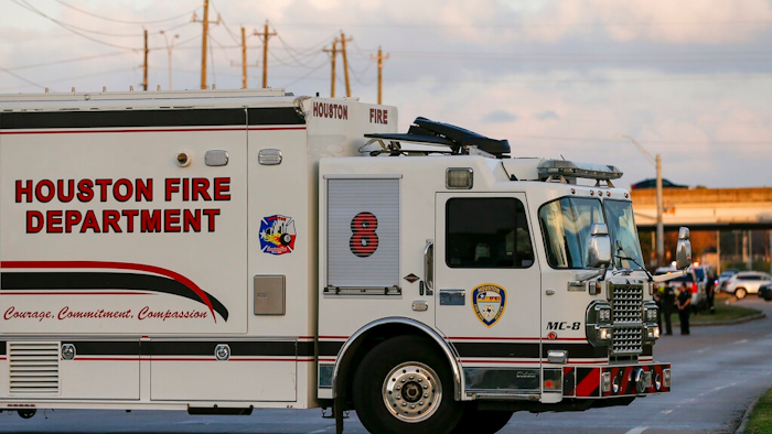In this Sunday, Dec. 15, 2019 photo, officials respond to the scene of a mercury spill on the intersection of Westview Drive and West Sam Houston Parkway North. A person has been taken into custody for questioning after dozens of people were decontaminated as a precaution due to trace amounts of mercury spilled at three locations in Houston, the FBI said Monday.