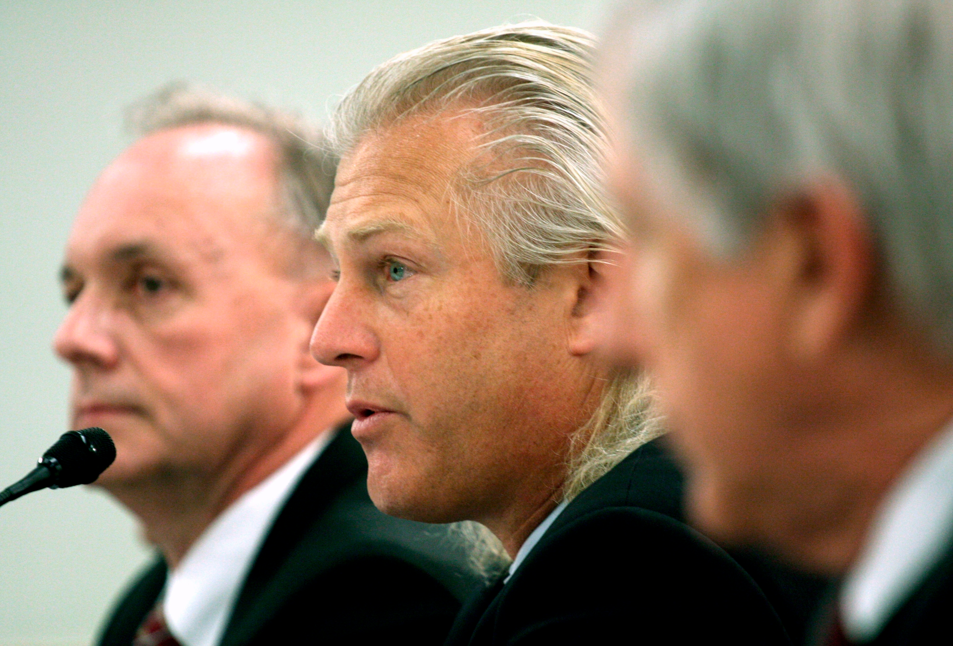 In this Feb. 26, 2008 file photo, Bumble Bee Foods President and Chief Executive Officer Christopher Lischewski, center, flanked by Butterball President and Chief Executive Officer Keith Shoemaker, left, and Dole Food Company President and Chief Executive Officer David DeLorenzo, testifies on Capitol Hill in Washington.