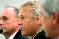 In this Feb. 26, 2008 file photo, Bumble Bee Foods President and Chief Executive Officer Christopher Lischewski, center, flanked by Butterball President and Chief Executive Officer Keith Shoemaker, left, and Dole Food Company President and Chief Executive Officer David DeLorenzo, testifies on Capitol Hill in Washington.