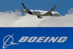 In this June 17, 2019, file photo, an Airbus A 350 - 1000 performs his demonstration flight at Paris Air Show in Le Bourget, east of Paris, France. Boeing's grounded 737 Max got a boost from two orders in November, but the American aircraft company continues to trail Europe's Airbus in both orders and deliveries of airline planes. Boeing disclosed Tuesday, Dec. 10, that it received 11 net orders in November, 63 new orders but 52 cancellations.