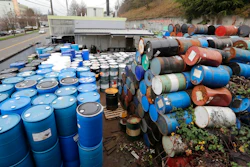 Dozens of barrels fill an outside storage area at Seattle Barrel and Cooperage Wednesday, Dec. 18, 2019, in Seattle. The century-old Seattle barrel company has been indicted along with its third-generation owner in what prosecutors describe as a long-running pollution conspiracy. The 36-count indictment, made public in U.S. District Court in Seattle on Wednesday, says the company used a hidden drain to pump caustic wastewater directly into the King County sewer system. That's despite telling officials that the company reused all its wastewater and didn't discharge any.