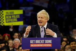 Britain's Prime Minister Boris Johnson speaks during his ruling Conservative Party's final election campaign rally at the Copper Box Arena in London, Wednesday, Dec. 11, 2019. Britain goes to the polls on Dec. 12.