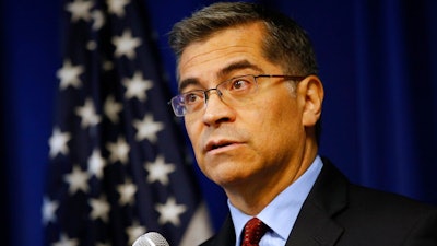 California Attorney General Xavier Becerra discusses settlements reached with 52 automobile parts manufacturers for illegal bid rigging during a news conference Wednesday, Dec. 4, 2019, in Sacramento, Calif. Becerra says the state recovered more than $23 million in the scheme that inflated consumer costs.