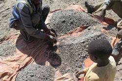 François and his 13-year-old son, Charles, sort stones before taking them to a nearby trading house that buys the ore, Democratic Republic of Congo, 2016.