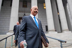 In this Oct. 22, 2019, file photo, Ted Wells, Jr., the lead attorney for Exxon, leaves New York Supreme Court in New York, after opening arguments in a lawsuit against Exxon. Exxon Mobil prevailed Tuesday, Dec. 10, 2019, in a lawsuit accusing the energy giant of downplaying the toll that climate change regulations could take on its business, with a judge saying the state attorney general's case didn't prove the company deceived investors — but also didn't excuse it of any accountability for global warming.