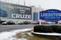 In this Nov. 27, 2018, file photo a banner depicting the Chevrolet Cruze model vehicle is displayed at the General Motors' Lordstown plant in Lordstown, Ohio. General Motors is selling the Ohio assembly plant it closed in March to a new company that plans to begin making electric trucks in late 2020. The company called Lordstown Motors Corp. said Thursday, Nov. 7, 2019, that it initially intends to hire 400 production workers but still needs more money from investors.
