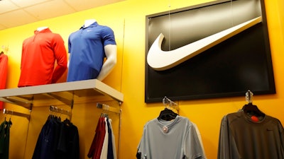 In this Nov. 29, 2019, file photo Nike clothes are displayed at a Kohl's store in Colma, Calif. Nike Inc. reports earnings on Thursday, Dec. 19.