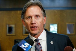 In this Oct. 15, 2019 file photo, Oklahoma Attorney General Mike Hunter talks with reporters following a hearing to settle disagreements between Johnson & Johnson and the State over Judge Thad Balkman's final judgement in the opioid lawsuit, in Norman, Okla. The state of Oklahoma filed an appeal Monday, Dec. 16, 2019 to a judge's order that Johnson & Johnson pay $465 million to address the state's opioid crisis. Hunter's office argues the award is only enough to pay for one year of the state's abatement plan.