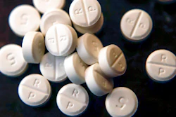 This June 17, 2019, file photo shows 5-mg pills of Oxycodone. The judge overseeing the bankruptcy case of OxyContin maker Purdue Pharma will consider Wednesday, Dec. 4, 2019 whether the company's CEO should get a bonus equal to half his $2.6 million salary.
