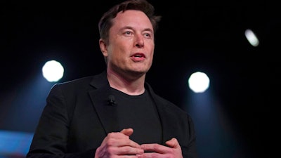 In this March 14, 2019, file photo, Tesla CEO Elon Musk speaks before unveiling the Model Y at Tesla's design studio in Hawthorne, Calif. Musk is going on trial for his troublesome tweets in a case pitting the billionaire against a British diver he allegedly dubbed a pedophile.