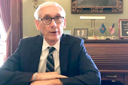 Wisconsin Gov. Tony Evers sits for an interview with The Associated Press Thursday, Dec. 19, 2019, saying that Foxconn Technology Group, the world's largest electronics manufacturer, could still qualify for up to $3 billion in state tax credits in Wisconsin if it makes changes to its deal with the state to reflect current plans for a plant that's under construction. Evers said Thursday. 'If we have a deal that is reflective of what they are doing, it's logical that they will get the credits,' 'But if they don't, that's a whole different deal.'