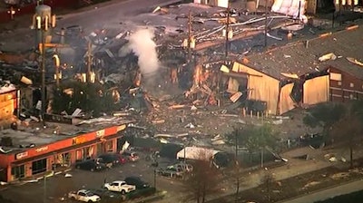 This aerial photo taken from video provided by KTRK-TV shows damage to buildings after an explosion in Houston on Friday, Jan. 24. A large explosion left rubble scattered in the area, damaged nearby homes and was felt for miles away. A fire continues to burn and people have been told to avoid the area.