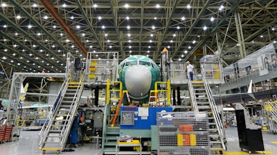 In this Dec. 7, 2015 file photo, a Boeing 737 MAX airplane being built is shown on the assembly line in Renton, WA.