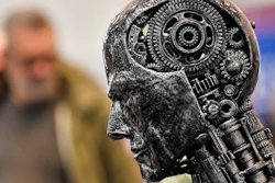 In this Nov. 29, 2019, file photo, a metal head made of motor parts symbolizes artificial intelligence, or AI, at the Essen Motor Show for tuning and motorsports in Essen, Germany. The Trump administration is proposing new rules guiding how the U.S. government regulates the use of artificial intelligence in medicine, transportation and other industries. The White House unveiled the proposals Tuesday, Jan. 7, and said they're meant to promote private sector applications of AI that are safe and fair.