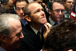 n this Jan. 26, 2011 file photo, Nielsen Company CEO David Calhoun, center, watches progress as he waits for the company's IPO to begin trading, on the floor of the New York Stock Exchange. Calhoun took over Monday, Jan. 13, 2020, as Boeing's third CEO in the last five years, following the firing last month of Dennis Muilenburg.