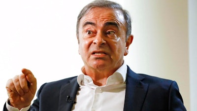 Former Nissan Chairman Carlos Ghosn speaks to Japanese media during an interview in Beirut, Lebanon, Friday, Jan. 10, 2020.