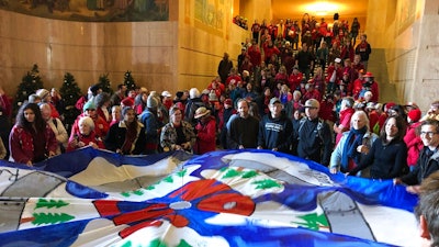 In this Nov. 21, 2019, file photo, demonstrators against a proposed liquid-natural gas pipeline and export terminal in Oregon flooded into the State Capitol in Salem, Ore., to demand Democratic Gov. Kate Brown stand against the proposal.