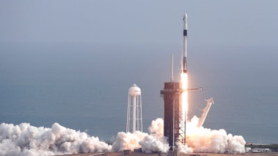 A Falcon 9 SpaceX rocket lifts off from pad 39A during a test flight to demonstrate the capsule's emergency escape system at the Kennedy Space Center in Cape Canaveral, Fla., Sunday, Jan. 19, 2020.