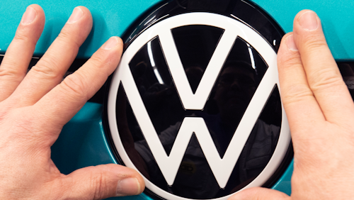 A worker completes an electric car ID.3 body at the assembly line during a press tour at the plant of the German manufacturer Volkswagen AG (VW) in Zwickau, eastern Germany, Tuesday, Feb. 25, 2020.
