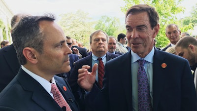 In this April 26, 2107 photo, Braidy Industries Inc. CEO Craig Bouchard, right, and Republican Gov. Matt Bevin speak with reporters in Wurtland, Ky.