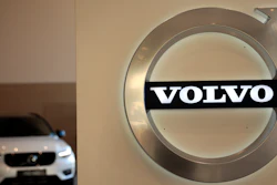 A Volvo car is parked behind the Volvo logo in the lobby of the Volvo corporate headquarters, prior to a media conference on the 2019 Full Year Financial Results, in Brussels, Thursday, Feb. 6, 2020.