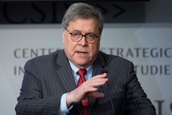 Attorney General William Barr gives the keynote address to the Center for Strategic and International Studies, CSIS China Initiative Conference, Thursday, Feb. 6, 2020, in Washington. (AP Photo/Cliff Owen)