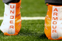 This March 5, 2017, file photo shows a closeup of Under Armour cleats seen before a drill at the 2017 NFL football scouting combine in Indianapolis.