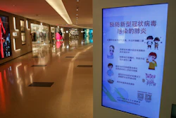 In this Feb. 9 photo, an electronic display board showing a precautionary notice of the coronavirus at a deserted upscale shopping mall in Beijing. Chinese authorities are struggling to strike a delicate balance between containing a deadly viral outbreak and restarting the world’s second-biggest economy after weeks of paralysis.