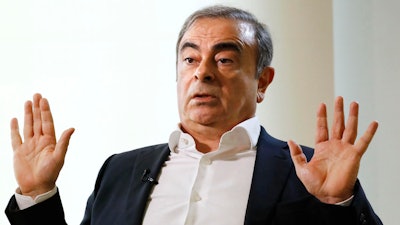 In this Jan. 10, 2020, file photo, former Nissan Chairman Carlos Ghosn speaks to Japanese media during an interview in Beirut, Lebanon.