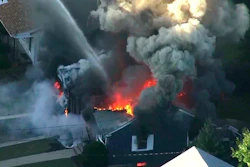 In this Sept. 13, 2018 file image from video provided by WCVB in Boston, flames consume the roof of a home following an explosion in Lawrence, Mass.