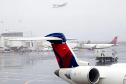 In this Oct. 29, 2019, file photo Delta planes are parked at the new $3.9 billion Terminal C at LaGuardia Airport in New York. Delta Air Lines said Friday, Feb. 14, 2020, that it will invest $1 billion over the next 10 years in measures designed to offset climate-warming carbon emissions from its planes.