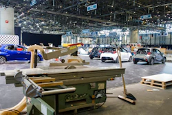 Cars are pictured as workers stop the preparation of the 90th Geneva International Motor Show, GIMS, at Palexpo, in Geneva, Switzerland, Friday, Feb. 28, 2020. The 90th edition of the International Motor Show, scheduled to begin on March 5th, is cancelled due to the advancement of the (Covid-19) coronavirus in Switzerland. The Swiss confederation announced today that all events involving more than 1,000 people would be banned until 15 March.