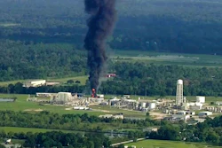 In this Sept. 1, 2017, file photo, smoke rises from the Arkema Inc. owned chemical plant in Crosby, near Houston, Texas. In February 2020, the Pennsylvania-based company, which is a subsidiary of a French chemical manufacturer, and three of its executives are set to stand trial in Houston in a case that legal experts say will be a challenge for prosecutors to win.