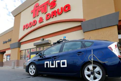 In this Aug. 16, 2018 file photo, a self-driving Nuro vehicle parks outside a Fry's supermarket in Scottsdale, Ariz. For the first time, the U.S. government's highway safety agency has approved a Nuro's request to deploy a self-driving vehicle that doesn't meet federal safety standards for human-driven cars and trucks. The National Highway Traffic Safety Administration granted temporary approval for the Silicon Valley robotics company to run a low-speed autonomous delivery vehicle without side and rear-view mirrors used by human drivers.