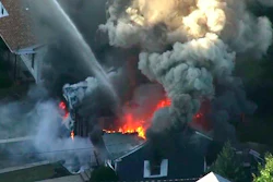 In this Sept. 13, 2018 file image from video provided by WCVB in Boston, flames consume the roof of a home following an explosion in Lawrence, Mass.