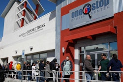 People wait in line for help with unemployment benefits at the One-Stop Career Center, Tuesday, March 17, 2020, in Las Vegas.