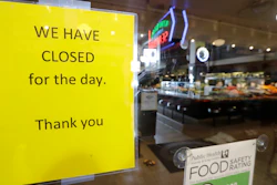 A sign advises of the closure of a restaurant at Pike Place Market on Tuesday, March 17, 2020, in Seattle. Many shops in the landmark market continue to remain open, though business has dropped considerably in recent weeks.