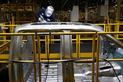 In this Nov. 11, 2014 photo, Ron Hudgins welds a 2015 Ford F-150 cab at the Dearborn Truck Plant in Dearborn, Mich.
