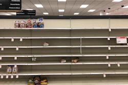 Shelves usually stocked with bread lay nearly empty at a Target in Abington, PA on Wednesday, March 18.