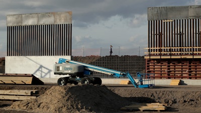 In this Nov. 7, 2019, file photo, the first panels of levee border wall are seen at a construction site along the U.S.-Mexico border, in Donna, Texas.