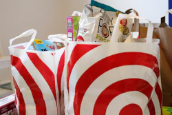 In this Sunday, March 29, 2020, photo, groceries loaded in plastic bags are seen after a shopping trip in Portland, Ore.