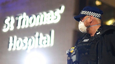 A police officer stands outside St Thomas' Hospital in central London as British Prime Minister Boris Johnson was moved to intensive care after his coronavirus symptoms worsened on Monday April 6, 2020. Johnson was admitted to St Thomas' hospital in central London on Sunday after his coronavirus symptoms persisted for 10 days. Having been in hospital for tests and observation, his doctors advised that he be admitted to intensive care on Monday evening.