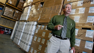 In this April 29, 2009, file photo, Don Wood, an official with the Strategic National Stockpile, awaits another truck load of medications in Salt Lake City, Utah during a swine flu outbreak from the H1N1 virus. The 2009 H1N1 pandemic prompted the largest use to date of the stockpile, which was created in 1999. It has never confronted anything on the scale of the current COVID-19 pandemic.